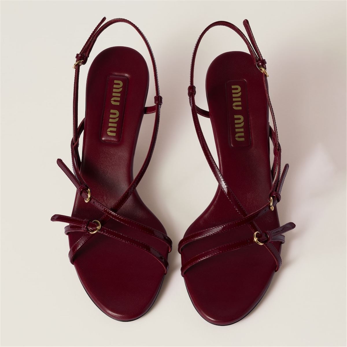PATENT LEATHER SANDALS WITH BUCKLES -  MIU MIU -  Verso
