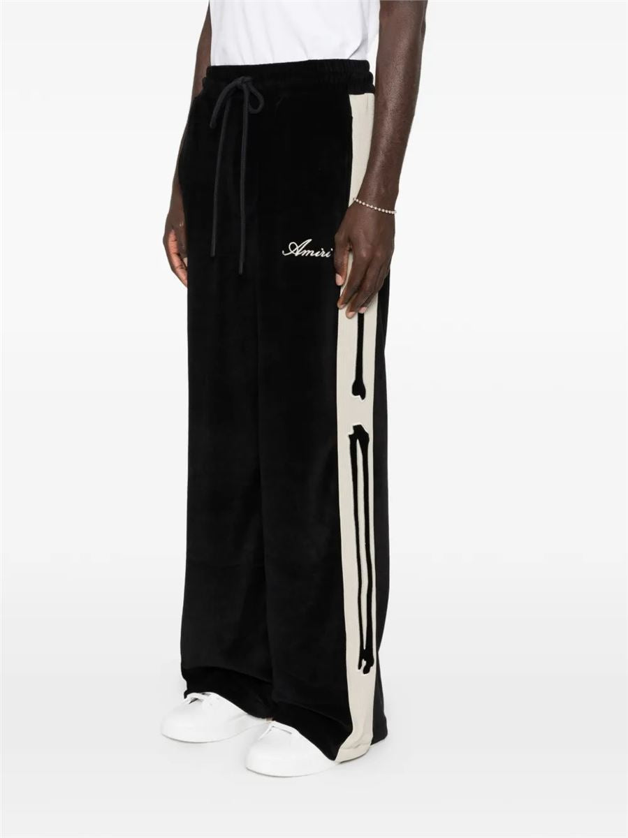 Bones velvet-effect track pants-AMIRI-Verso
