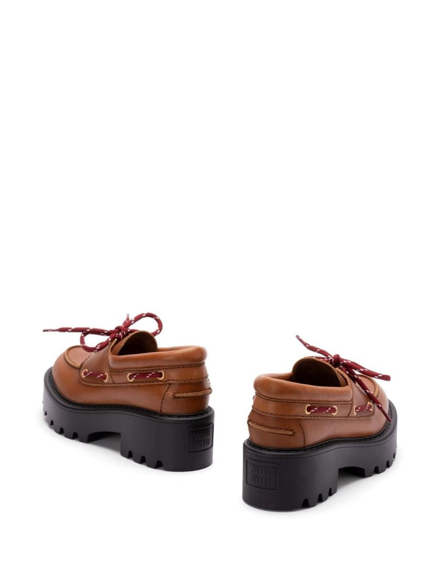 LEATHER LOAFERS MIU MIU