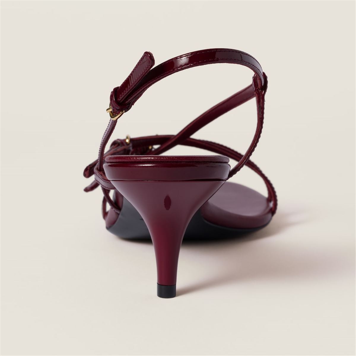 PATENT LEATHER SANDALS WITH BUCKLES -  MIU MIU -  Verso