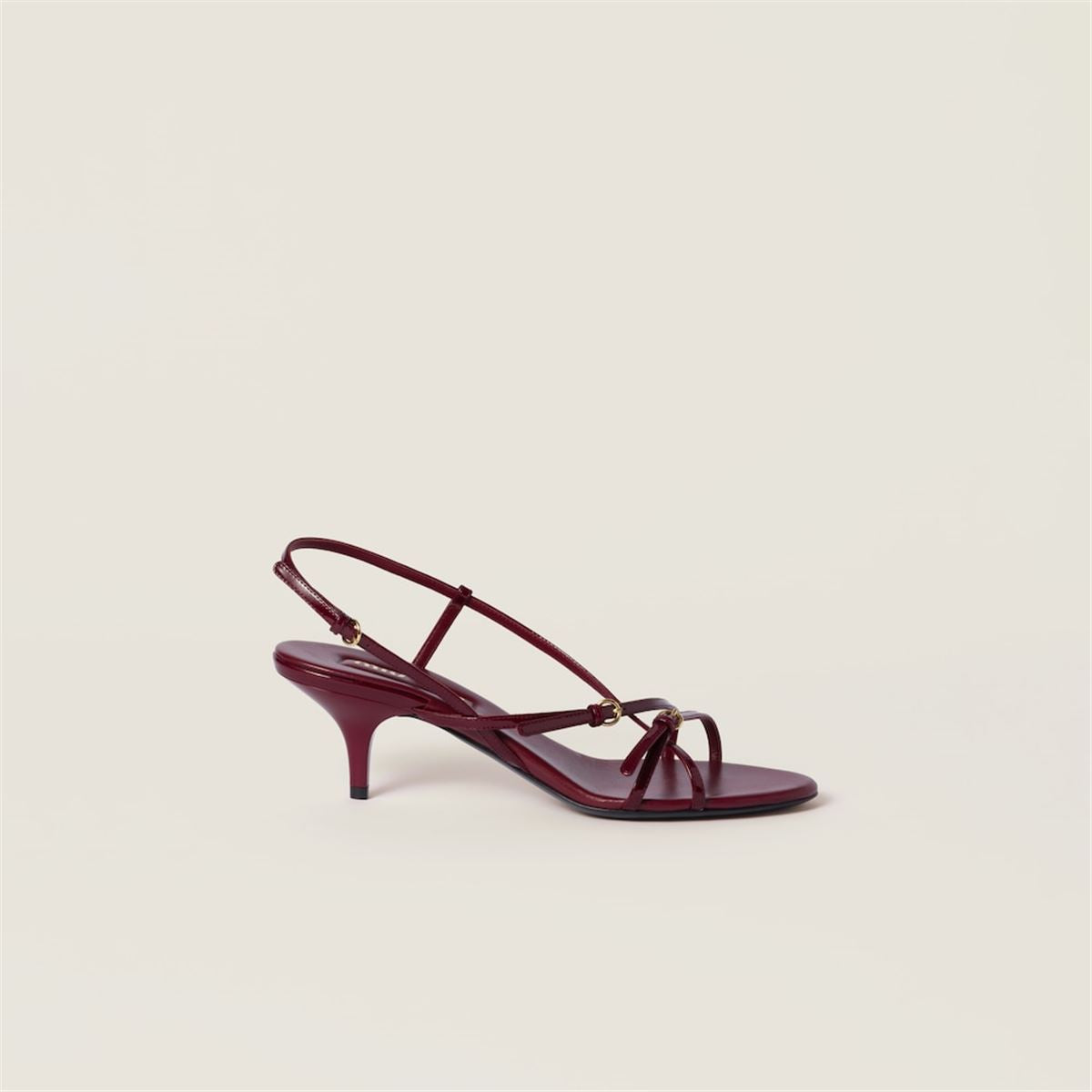 PATENT LEATHER SANDALS WITH BUCKLES -  MIU MIU -  Verso