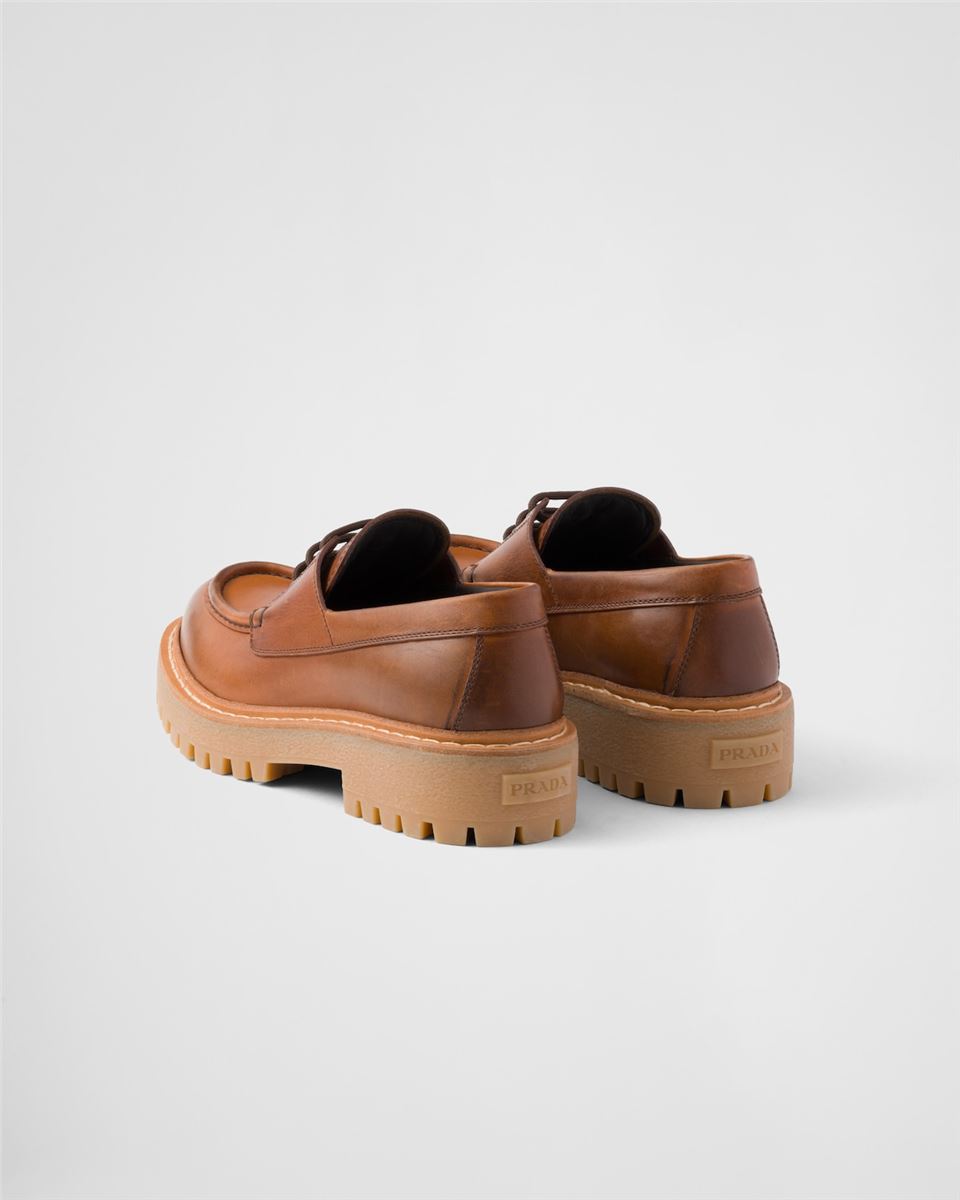 LACED LEATHER LOAFERS -  PRADA -  Verso