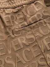 ALLOVER LOGO-PRINT CARGO TROUSERS