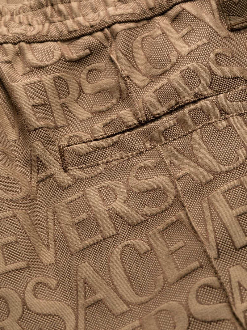 ALLOVER LOGO-PRINT CARGO TROUSERS