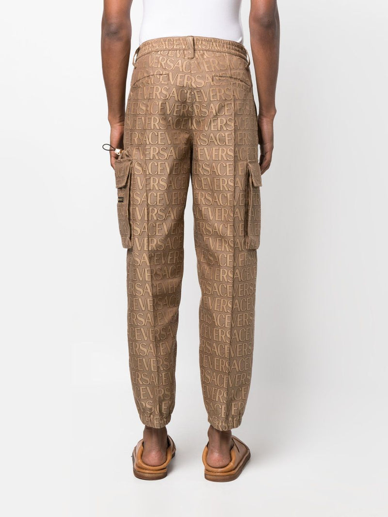 ALLOVER LOGO-PRINT CARGO TROUSERS